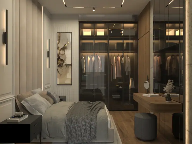 Apartment bedroom featuring an illuminated dark glass wardrobe, wooden vanity desk, and grey pouf in Esentepe, North Cyprus.