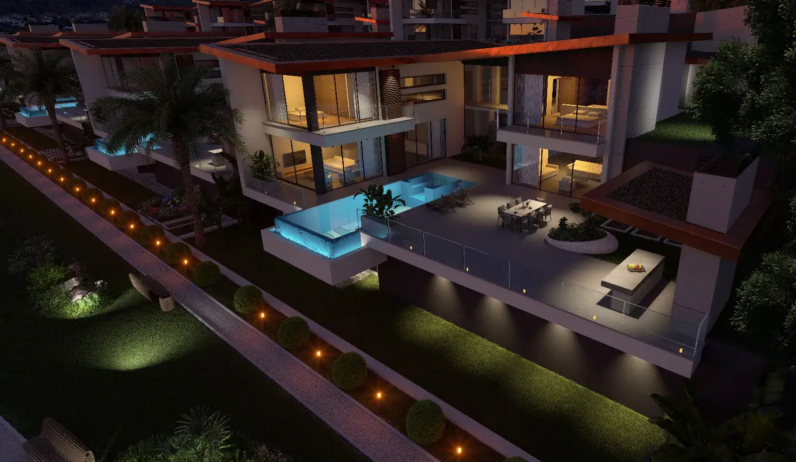 Elevated nighttime rendering of modern luxury villas featuring private illuminated pools, spacious terraces, and beautifully lit garden pathways.