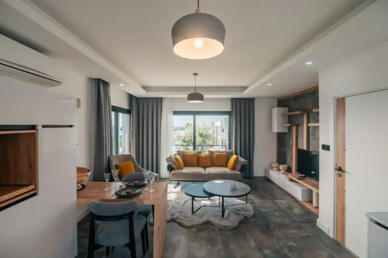 Spacious living area featuring a comfortable sofa, coffee table, and contemporary decor.