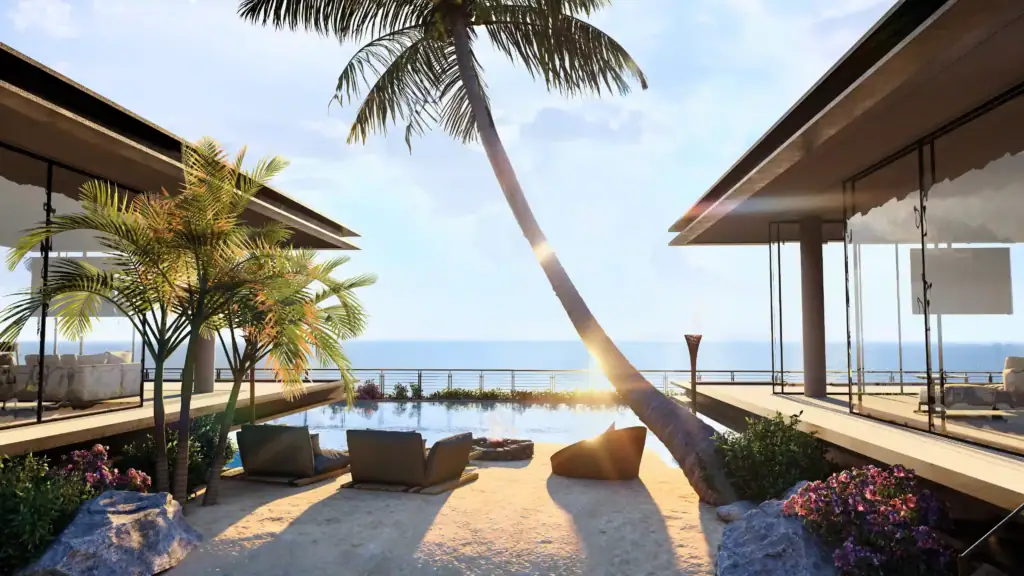Modern luxury villa terrace featuring a swimming pool, lounge chairs, a fire pit, and a leaning palm tree against a sunset ocean backdrop.