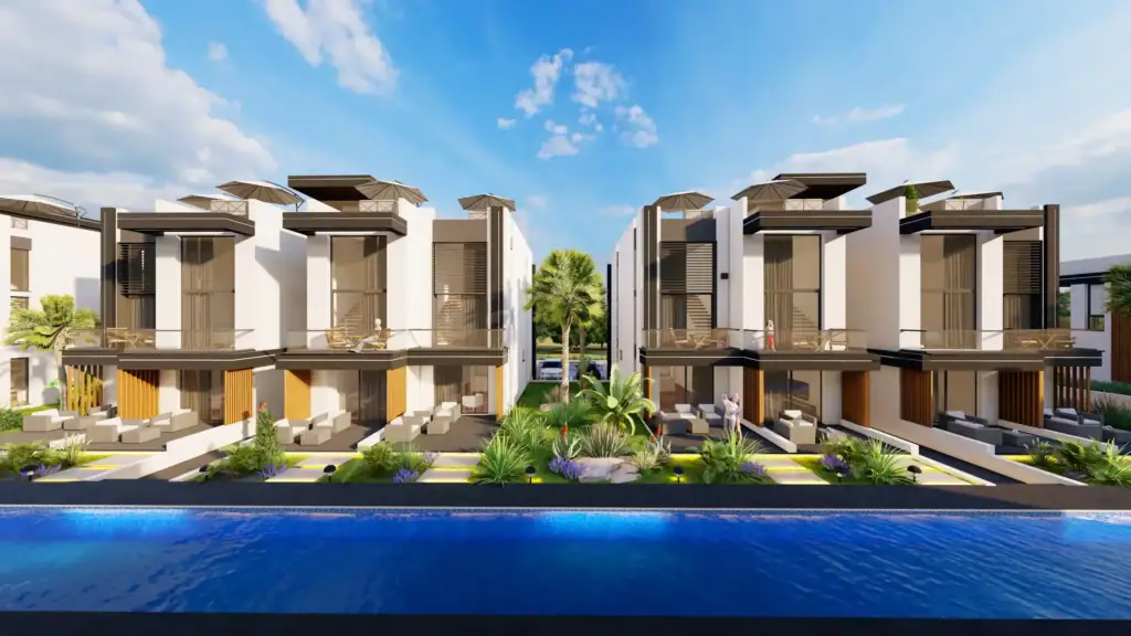 Modern multi-unit luxury villas with elegant white facades, private patios, and a large blue swimming pool in the foreground.