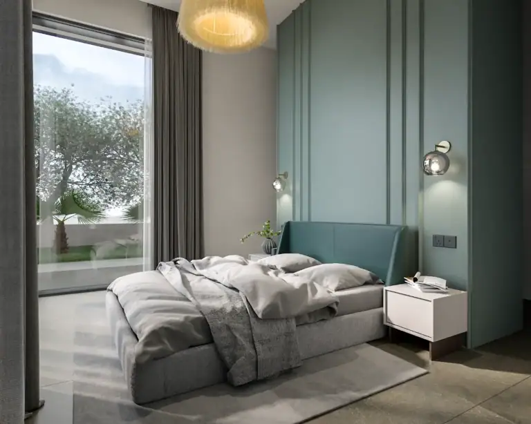 Bright bedroom with sea view, stylish decor, and modern furnishings in a North Cyprus property development.