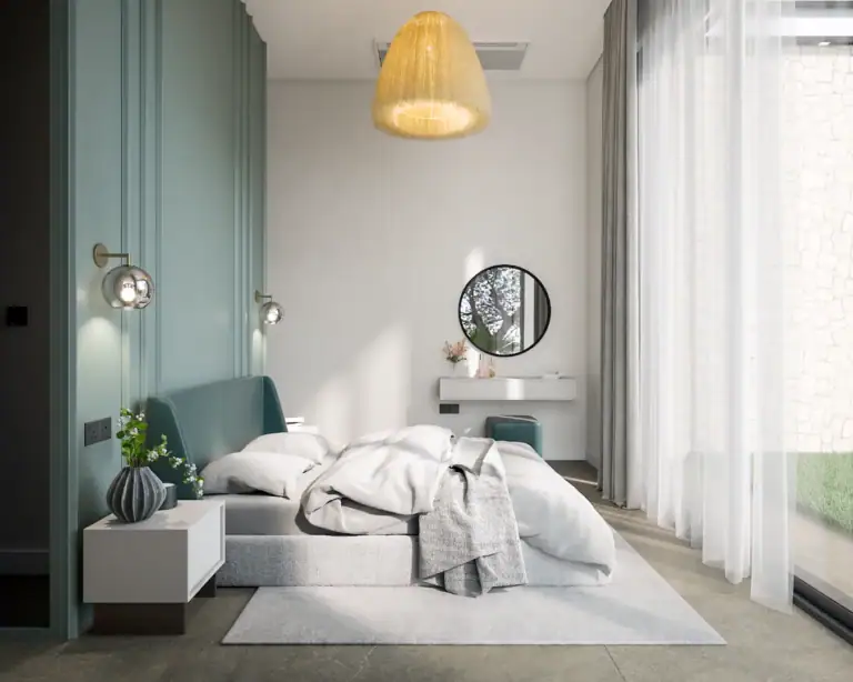 Bright bedroom featuring a green accent wall, stylish decor, and floor-to-ceiling curtains overlooking a garden.