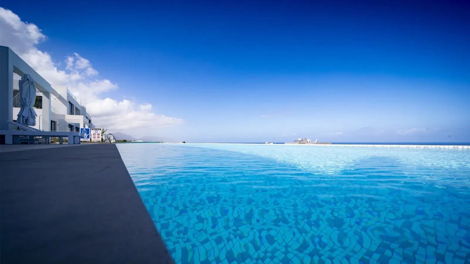 Luxury infinity pool overlooking the Mediterranean Sea at a North Cyprus resort.